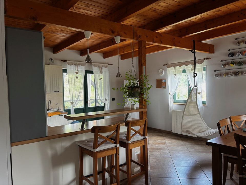 Kitchen with exposed wooden beams